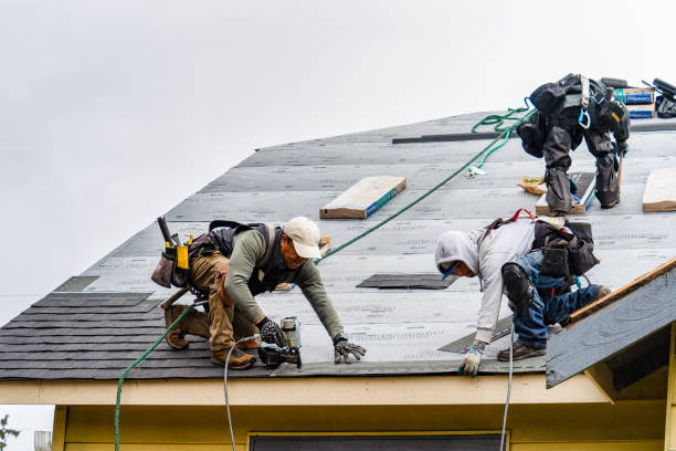 Professional Gutter Installation technician working in Raynham Center, MA